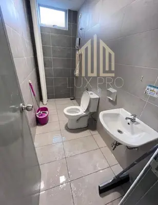 a bathroom with a toilet and a sink at Residensi prima kampung paloh in Ipoh