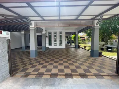 an empty arcade with a checkered floor in a building at Hi-Tea HomeStay in Sungai Petani