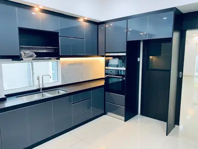 a kitchen with blue cabinets and a sink at Homestay Bintang Maya in Sungai Petani