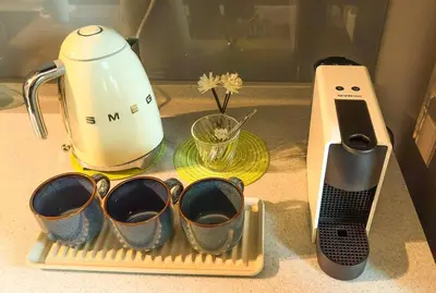 a kitchen counter with four measuring cups and a blender at Penang Oceanview Loft in George Town