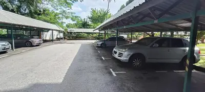 a parking lot with two cars parked in it at Japan Comfort Lifestyle Hokkaido in Ipoh