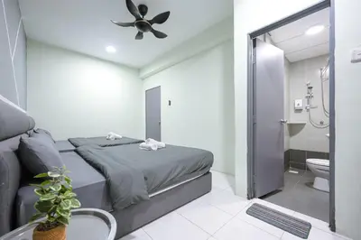 a bedroom with a bed and a bathroom with a shower at Lavender Dream Brinchang Cozy Family 10 Pax Clover Home 8-01 in Brinchang