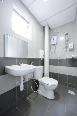 a bathroom with a toilet and a sink at Lavender Dream Brinchang Cozy Family 10 Pax Clover Home 8-01 in Brinchang
