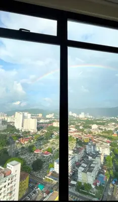 a view of a city from a window at The Floral Retreat N3w Cozy High floor Beacon Executive Suite in George Town