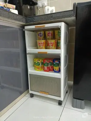 a small refrigerator with food inside of it at Jemput Rezeki Homestay in Bayan Lepas