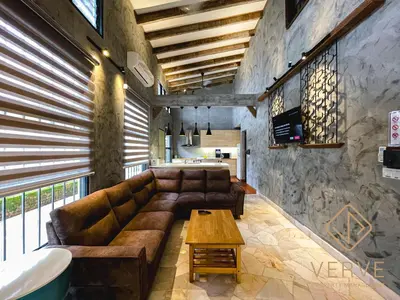 a living room with a couch and a table at R Private Club House 4B4B 16 pax by Verve in Ipoh