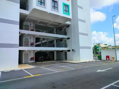a large white building with a parking lot at IFS SoHo 2 Basic Studio in Seri Iskandar