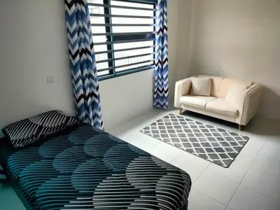a bedroom with a bed and a chair and a window at IFS SoHo 2 Basic Studio in Seri Iskandar