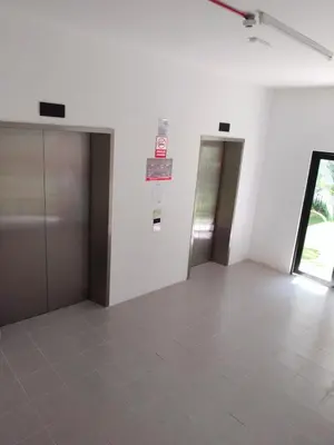 an empty room with two doors and a tiled floor at IFS SoHo 2 Basic Studio in Seri Iskandar