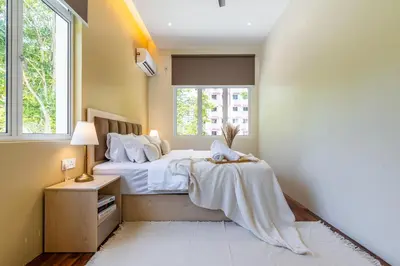 a bedroom with a bed and a window at La Ferringhi Villa - Tropical Collection, by ALV in Batu Ferringhi