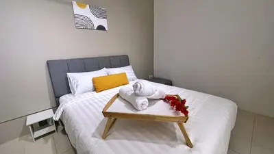 a bed with a tray with a towel on it at BM IconCity Landed Home by Wemestay - Near AutoCity, Juru, Penang Bridge in Bukit Mertajam