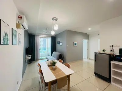 a kitchen and living room with a table and a dining room at Mansion One l 7 pax 2R2B l Cityview l Gleneagles l by PerfectSweetHome in George Town