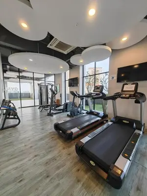 a gym with several treadmills and elliptical machines at Island Jazz Loft with Bathtub & Seaview - Jazz Suites by Ocean Luxe in Tanjong Tokong