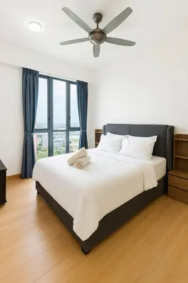 a bedroom with a large bed with a ceiling fan at Island Jazz Loft with Bathtub & Seaview - Jazz Suites by Ocean Luxe in Tanjong Tokong