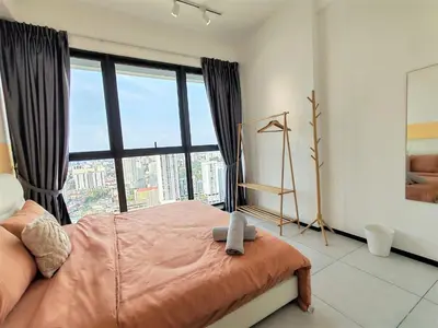 a bedroom with a bed and a large window at Urban Suites, 2 Rooms, 5 Pax, Free Car Park in Jelutong
