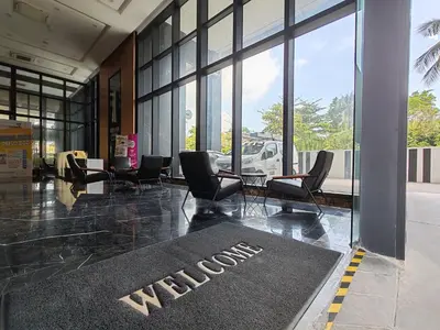 a lobby with chairs and a welcome mat on the floor at Urban Suites, 2 Rooms, 5 Pax, Free Car Park in Jelutong