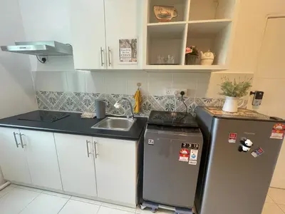 a small kitchen with a sink and a refrigerator at Ipoh The Anderson 5pax Suite #82 in Ipoh