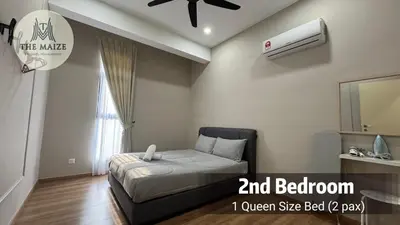 a bedroom with a bed and a air conditioner on the wall at Verdant Sunset The Cove Ipoh in Ipoh