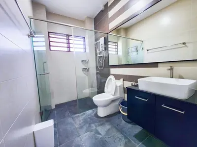 a bathroom with a toilet and a sink and a shower at 30 Bercham Double-Storey Homestay in Ipoh