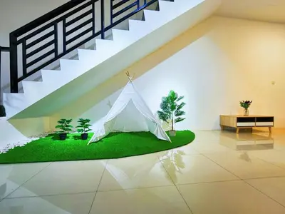 a tent in a room under a staircase at 30 Bercham Double-Storey Homestay in Ipoh