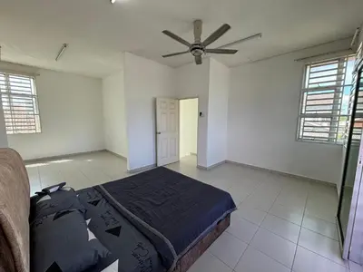 a bedroom with a bed and a ceiling fan at MDRS Seroja 6 in Kuala Ketil
