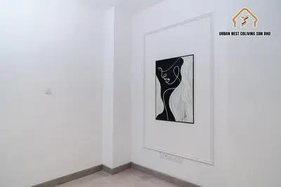 a picture of a woman in a black and white painting on a wall at Georgetown Elegant Chanel-style KTV 4BR 18Pax A in George Town