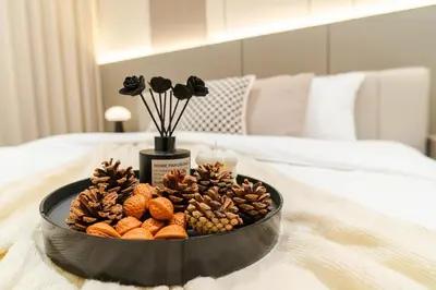 a tray of nuts and pine cones on a bed at Georgetown Stylish Design Jacuzzi KTV 5BR 16pax D in George Town