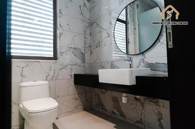 a bathroom with a toilet and a sink and a mirror at Georgetown Elegant Golden Jacuzzi KTV 5BR 16pax E in George Town