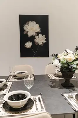 a dining room table with a picture of flowers at Georgetown Chanel-Style Jacuzzi & KTV 5BR 18pax F in George Town