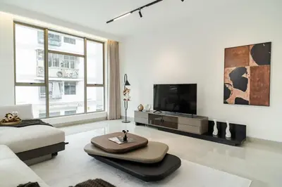 a living room with a couch and a tv at Georgetown Modern Brown-Colored KTV 5BR 18pax H in George Town