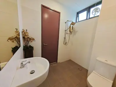 a bathroom with a toilet and a sink and a door at 2 Spacious Lupsxury conor villa garden Parking group family gathering wedding in Gelugor