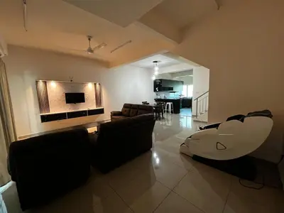 a living room with a couch and a tv at Homestay Adyana in Raub