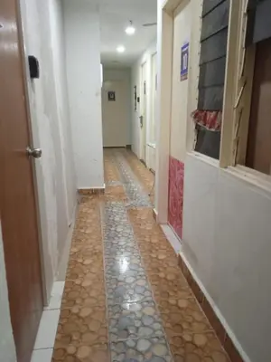 a hallway with a tile floor in a hallway at Cool view hotel in Tanah Rata