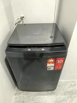 a black printer sitting on top of a wall at 32 Homestay in Teluk Intan