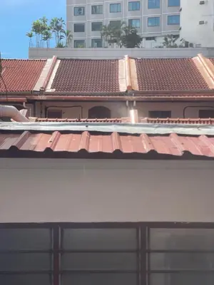 a view of a building with red roofs at Heritage House 123 in George Town