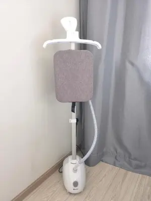 a white and gray lamp in the corner of a room at Iconic Regency Service Residences - Xin's Home in Bayan Lepas