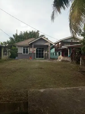 a house with a yard in front of it at Tasmie homestay in Butterworth