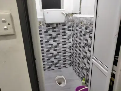 a bathroom with a sink and a toilet in it at Tasmie homestay in Butterworth