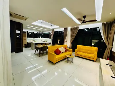 a living room with a yellow couch and a table at Opulent Villa for 20pax BBQ, Steps to Beach Market in Batu Ferringhi