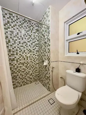 a bathroom with a toilet and a shower at Cozy Homestay in Karpal Singh by 3C in George Town