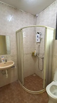 a bathroom with a shower and a sink at Comfy21 Homestay Tambun, Ipoh in Ipoh