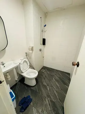 a bathroom with a toilet and a sink at AYAAN PENTHOUSE at QUINTET 5 BED ROOM & ROOFTOP SKY DINING in Tanah Rata