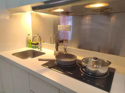 a kitchen stove with two pots and pans on it at Spacious 1BR 118 Island Plaza 4pax in George Town