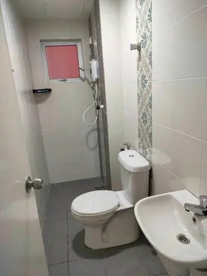 a bathroom with a toilet and a sink at VS Homestay in Ipoh