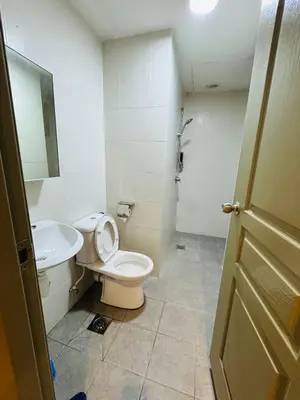 a bathroom with a toilet and a sink at AYAAN QUINTET Green Valley with Free Parking in Tanah Rata