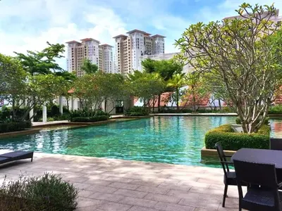 a large swimming pool in a city with tall buildings at Dreame Home by The Quay in George Town
