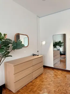 a room with a dresser and a mirror at W Home at Jalan Rangoon, George Town Penang in George Town