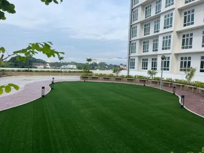 a green lawn in front of a building at The Anderson Ipoh AA1 Smart TV & 5G WiFi ready in Ipoh