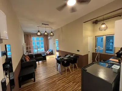 a room with a living room and a kitchen and a living room at The Anderson Ipoh AA1 Smart TV & 5G WiFi ready in Ipoh