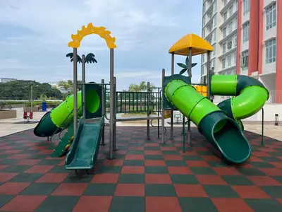 a playground with a green slide on a checkered floor at The Anderson Ipoh AA1 Smart TV & 5G WiFi ready in Ipoh